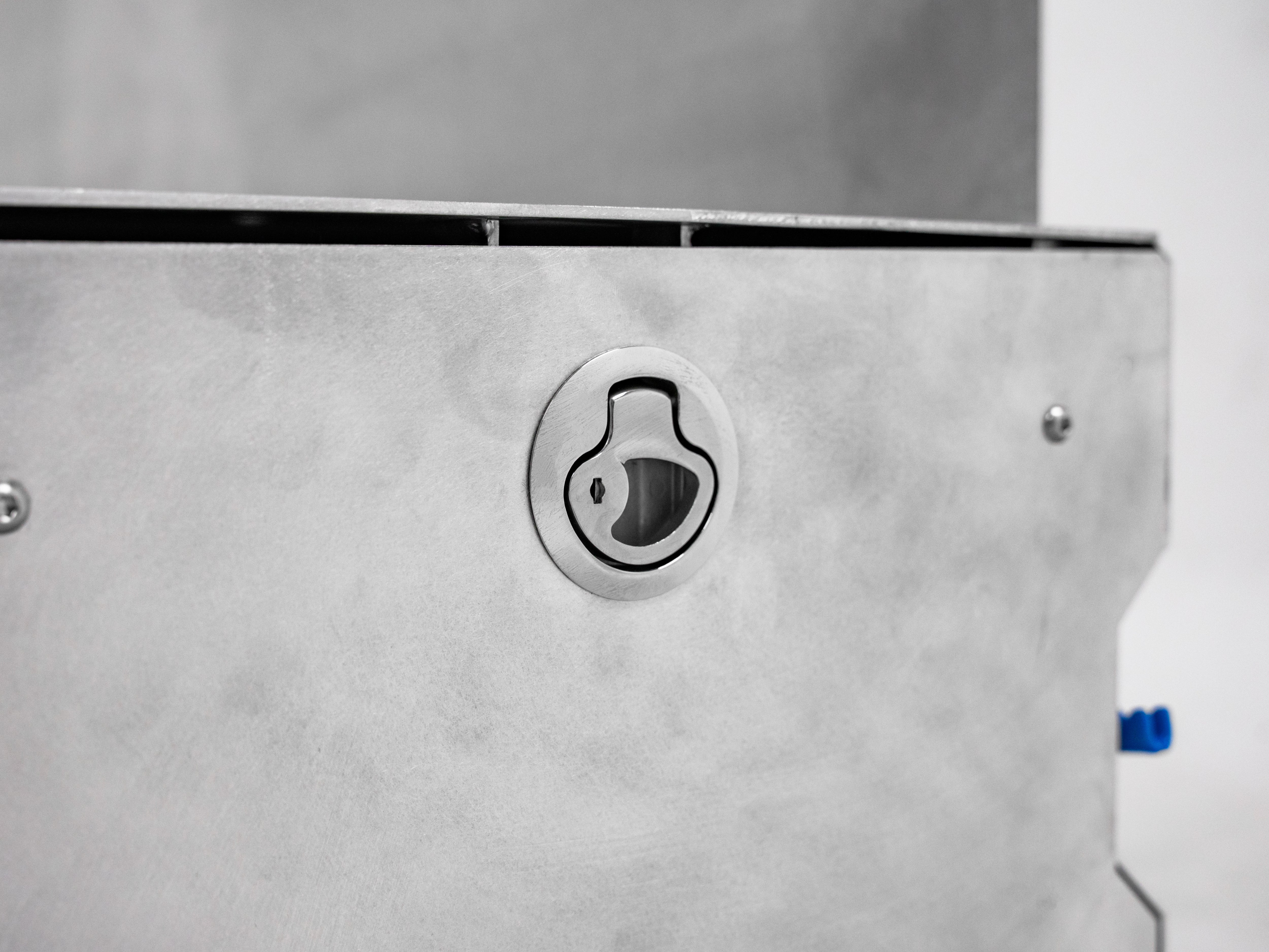 Lock detail on The Highway Tight modular aluminum seat delete system for secure storage.