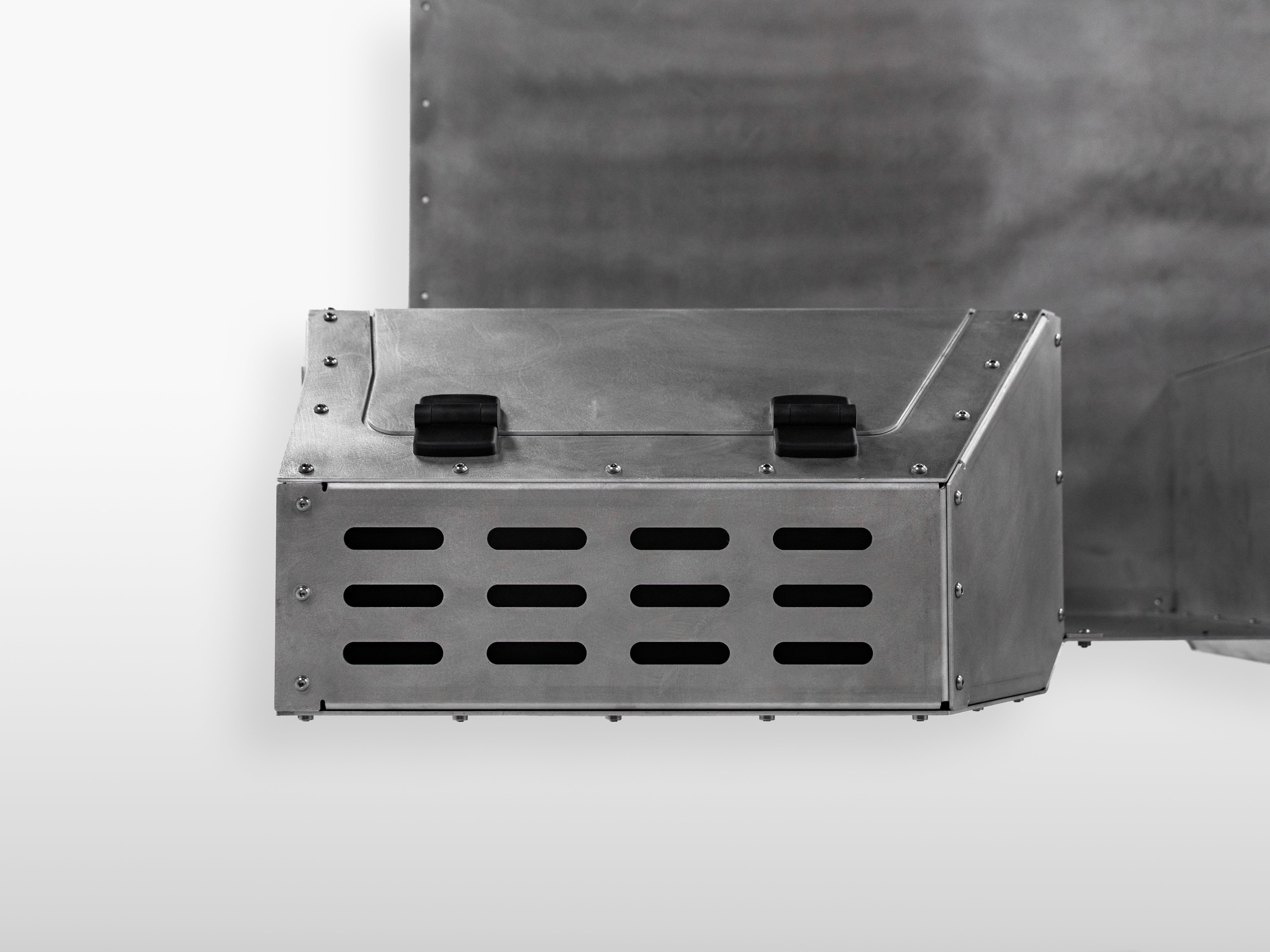 Front angled view showing the left compartment storage box of The Highway Tight aluminum seat delete system.