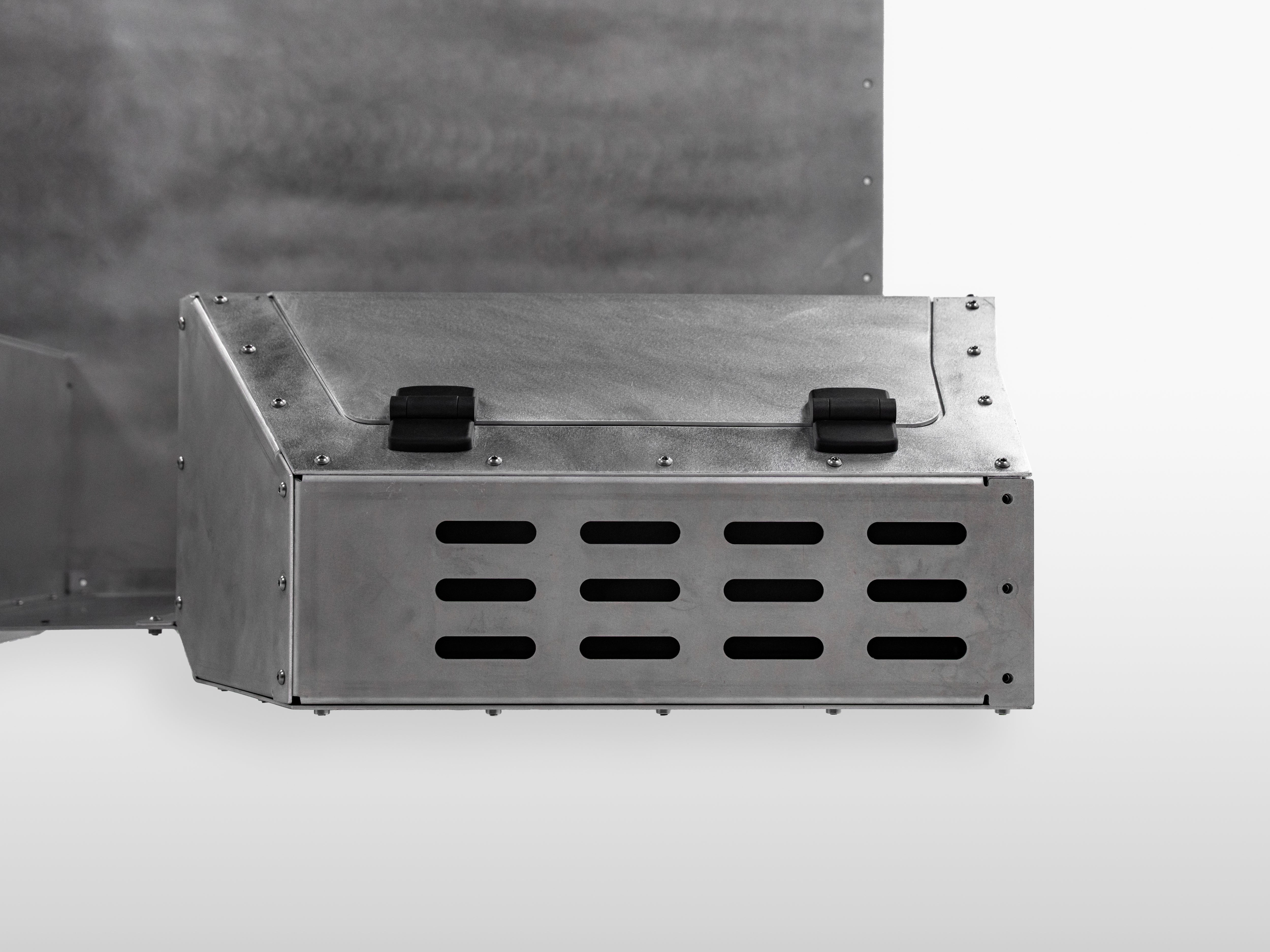 Front angled view showing the right compartment storage box of The Highway Tight aluminum seat delete system.