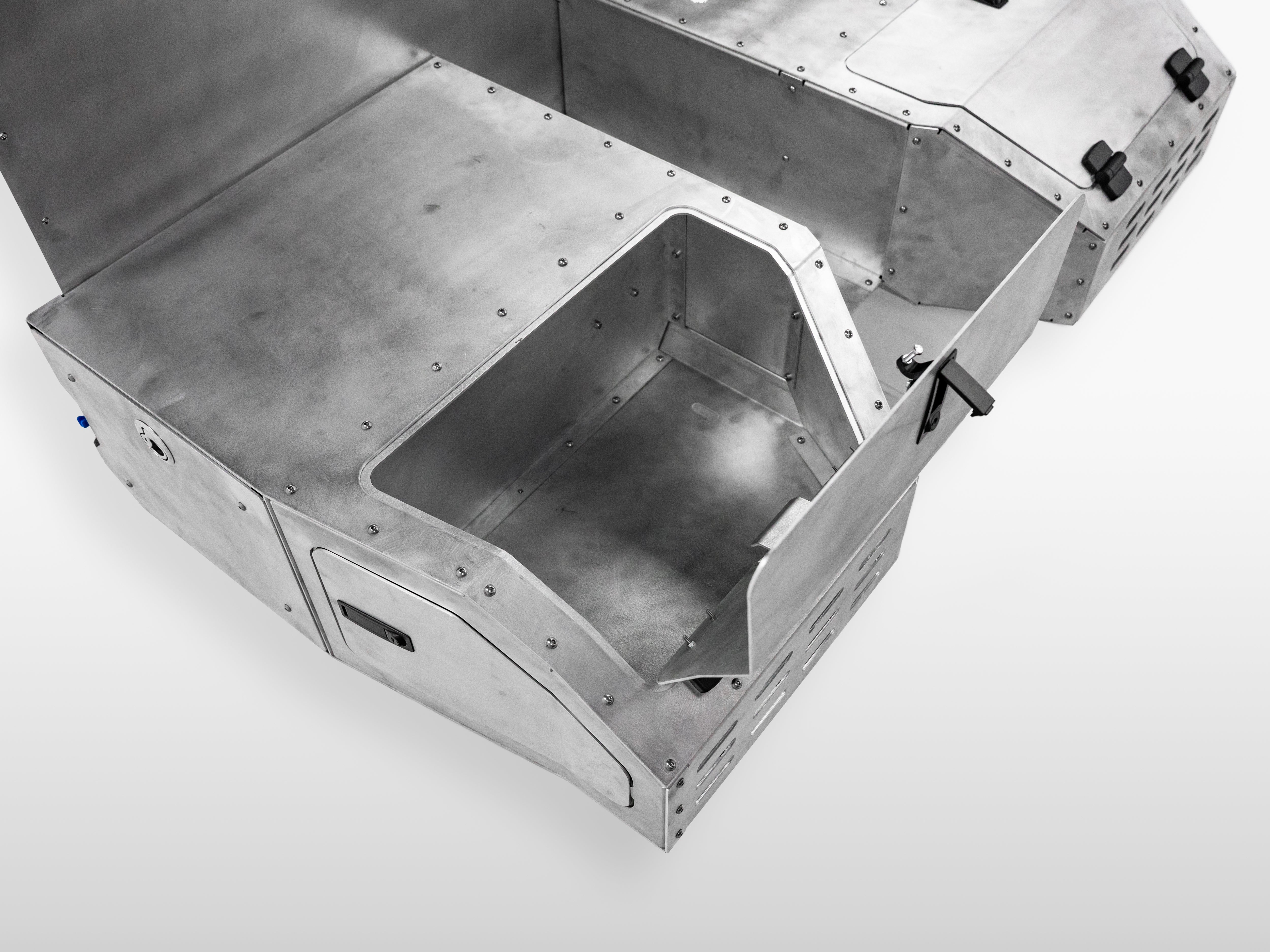 Open left side compartment of The Highway Tight aluminum storage system for rig welder truck setups.