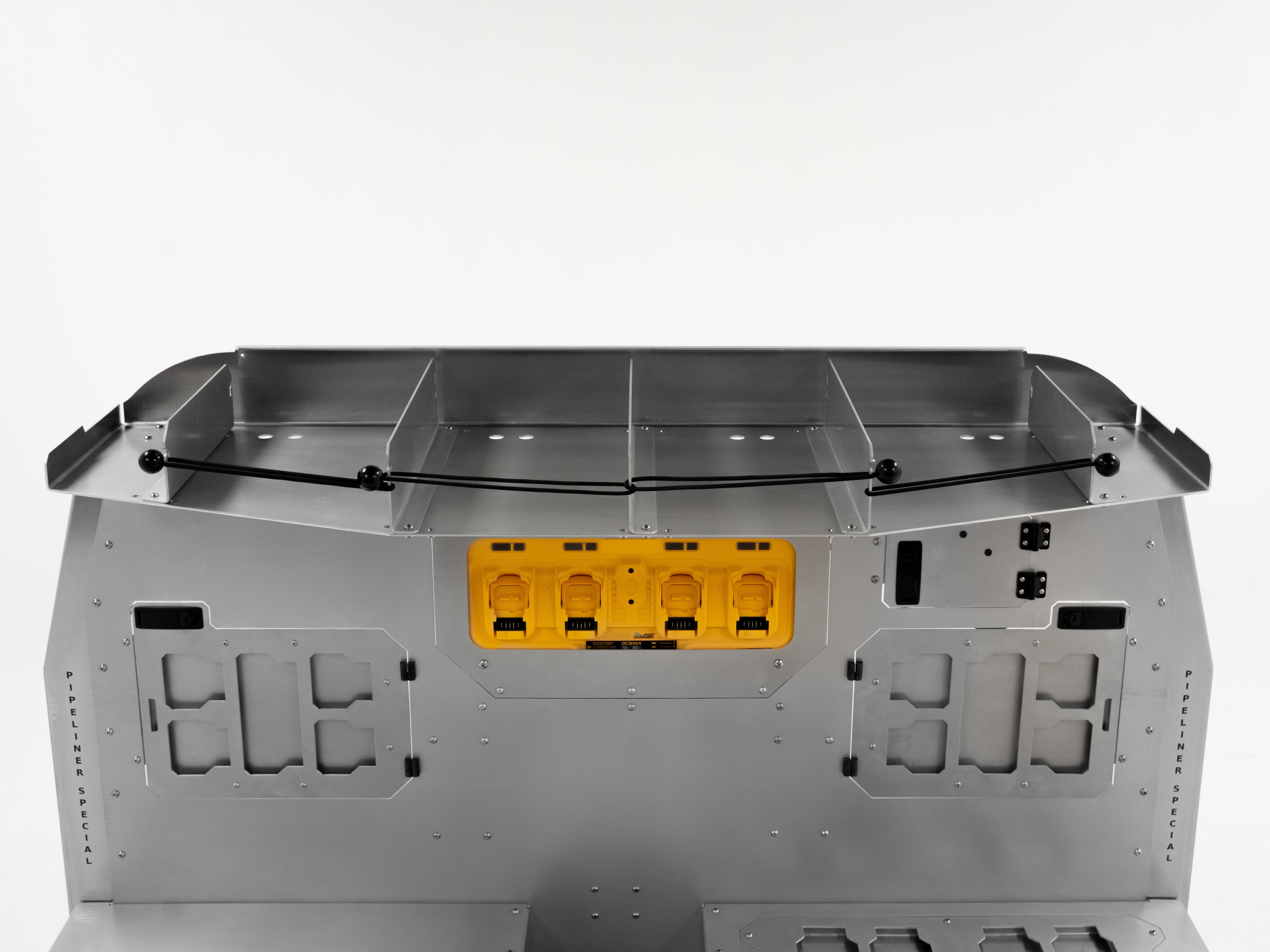 Top view of The Pipeliner Special seat delete system showing upper gear shelf and integrated yellow power outlets.